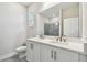 Bathroom featuring double vanity with stone countertop, and tiled walk-in shower at 2735 36Th N Ave, St Petersburg, FL 33713