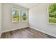 Bright bedroom with ample natural light, wood floors, and neutral color palette at 2735 36Th N Ave, St Petersburg, FL 33713