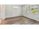 Bright bedroom featuring hardwood floors and natural light from large windows with beautiful outdoor views at 2735 36Th N Ave, St Petersburg, FL 33713