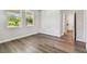 Bright bedroom featuring hardwood floors and natural light from large windows at 2735 36Th N Ave, St Petersburg, FL 33713