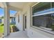 View of the home's exterior showcasing a window and door with a view to the outside at 2735 36Th N Ave, St Petersburg, FL 33713