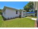 Exterior shot showcasing the home's well-maintained landscaping and neutral color palette at 2735 36Th N Ave, St Petersburg, FL 33713
