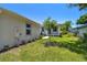 Angle view of the home's exterior showing landscaping and a side yard at 2735 36Th N Ave, St Petersburg, FL 33713