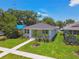 Charming single-story home with a well-manicured lawn and tidy landscaping at 2735 36Th N Ave, St Petersburg, FL 33713