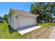 Attached one-car garage with a white door and exterior lighting at 2735 36Th N Ave, St Petersburg, FL 33713