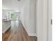 Hallway view showcasing the sleek wood flooring, light walls and open floorplan at 2735 36Th N Ave, St Petersburg, FL 33713