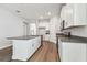 Modern kitchen with stainless appliances, center island, and ample cabinet space at 2735 36Th N Ave, St Petersburg, FL 33713