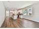 Bright, open floor plan features a kitchen with stainless appliances and wood-look floors at 2735 36Th N Ave, St Petersburg, FL 33713