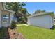 Side yard view showing the well-manicured landscaping and exterior of the home at 2735 36Th N Ave, St Petersburg, FL 33713