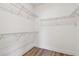 Walk-in closet featuring wire shelving, hardwood floors, and base trim at 2735 36Th N Ave, St Petersburg, FL 33713