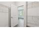 Walk-in closet featuring wire shelving, an open doorway, and hardwood floors at 2735 36Th N Ave, St Petersburg, FL 33713