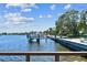 View from a dock showing a boat lift and waterfront homes at 2800 Coffee Pot Ne Blvd, St Petersburg, FL 33704