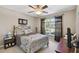 Spacious bedroom with ceiling fan and large window at 31330 Spoonflower Way, Brooksville, FL 34602