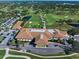 Large clubhouse with parking lot and landscaping at 4 Belleview Blvd # 402, Belleair, FL 33756