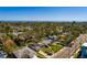Aerial view showing a single-Gathering home with a large yard, located near the water at 4211 Shore Acres Ne Blvd, St Petersburg, FL 33703