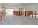 Under renovation living room with exposed framing and new flooring at 4211 Shore Acres Ne Blvd, St Petersburg, FL 33703
