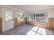 Sunroom undergoing renovation with new flooring and exposed framing at 4211 Shore Acres Ne Blvd, St Petersburg, FL 33703