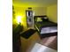 Bright bedroom with a double bed and nightstand at 4880 Locust Ne St # 234, St Petersburg, FL 33703