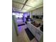 Kitchen with white cabinets and appliances at 4880 Locust Ne St # 234, St Petersburg, FL 33703