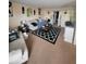Living room with comfy seating and patterned rug at 4880 Locust Ne St # 234, St Petersburg, FL 33703
