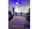 Living room with ceiling fan and large windows at 4880 Locust Ne St # 234, St Petersburg, FL 33703