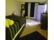 Main bedroom with large bed and dresser at 4880 Locust Ne St # 234, St Petersburg, FL 33703