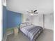 Bedroom with queen-size bed and two-toned accent walls at 5018 Bella Armonia Cir, Wimauma, FL 33598