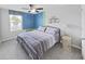 Bedroom with queen-size bed and two-toned accent walls at 5018 Bella Armonia Cir, Wimauma, FL 33598