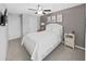 Bedroom with white bed and gray walls at 5018 Bella Armonia Cir, Wimauma, FL 33598