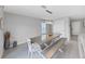 Farmhouse style dining room with trestle table and bench at 5018 Bella Armonia Cir, Wimauma, FL 33598