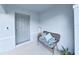 Covered front porch with seating area at 5018 Bella Armonia Cir, Wimauma, FL 33598
