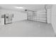 Attached garage with epoxy flooring and extra refrigerator at 5018 Bella Armonia Cir, Wimauma, FL 33598