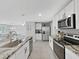 Modern kitchen with stainless steel appliances and granite countertops at 5018 Bella Armonia Cir, Wimauma, FL 33598