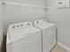 Bright laundry room with Whirlpool washer and dryer at 5018 Bella Armonia Cir, Wimauma, FL 33598