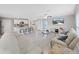 Spacious living area featuring a large TV and comfortable seating at 5018 Bella Armonia Cir, Wimauma, FL 33598