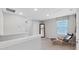 Spacious bedroom with large window and comfortable seating at 5018 Bella Armonia Cir, Wimauma, FL 33598