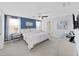 Main bedroom with blue accent wall and large bed at 5018 Bella Armonia Cir, Wimauma, FL 33598