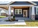 Charming craftsman front porch with wood ceiling and stone accents at 6917 N Central Ave, Tampa, FL 33604