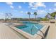 Community pool and spa with surrounding patio at 7400 Sun Island S Dr # 702, South Pasadena, FL 33707