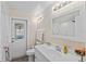 Bathroom with white vanity, shower, and view of pool at 7494 132Nd Way, Seminole, FL 33776