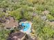 Community pool and surrounding buildings in lush landscape at 8722 Mallard Reserve Dr # 204, Tampa, FL 33614