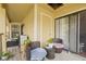 Spacious balcony with wicker chairs and small table at 8722 Mallard Reserve Dr # 204, Tampa, FL 33614
