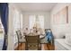 Charming dining area with a table and chairs near a balcony at 8722 Mallard Reserve Dr # 204, Tampa, FL 33614