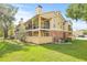 Two-story building with brick and siding, and a grassy lawn at 8722 Mallard Reserve Dr # 204, Tampa, FL 33614