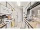 Updated kitchen with white cabinets, granite counters, and stainless steel appliances at 8722 Mallard Reserve Dr # 204, Tampa, FL 33614