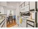 Clean and efficient kitchen featuring white cabinets and a stove top at 8722 Mallard Reserve Dr # 204, Tampa, FL 33614