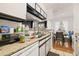 Kitchen with appliances, sink, and dining area at 8722 Mallard Reserve Dr # 204, Tampa, FL 33614