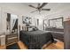 Spacious main bedroom with a ceiling fan and lots of natural light at 8722 Mallard Reserve Dr # 204, Tampa, FL 33614