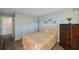 Bedroom with a double bed, dresser, and closet with bifold doors at 9433 Harbor Greens Way # 403, Seminole, FL 33776