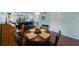 Round dining table with four chairs, near living room at 9433 Harbor Greens Way # 403, Seminole, FL 33776
